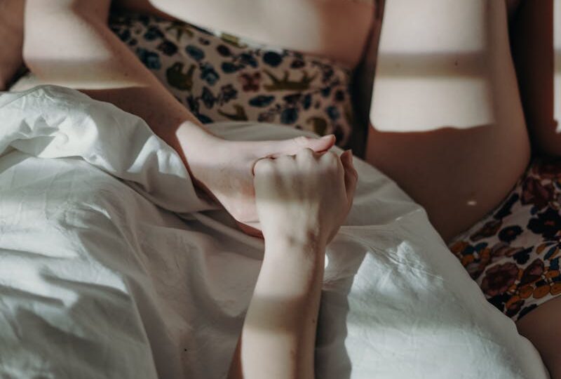 Women in Leopard Print Brassiere Lying on Bed